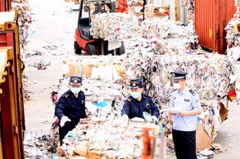 Chinese customs in Guangshou inspecting mixed paper